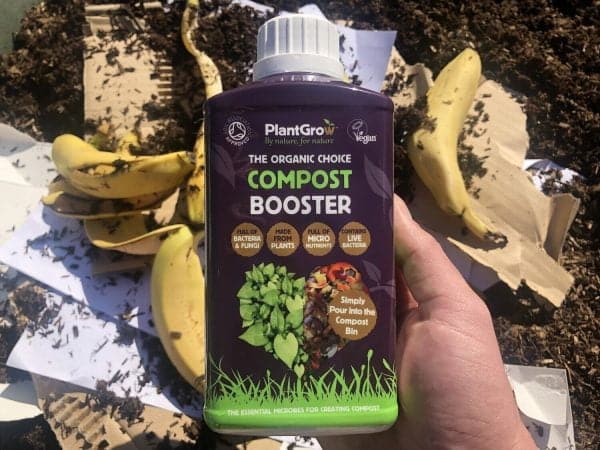 A detailed view of a bottle containing an organic compost booster