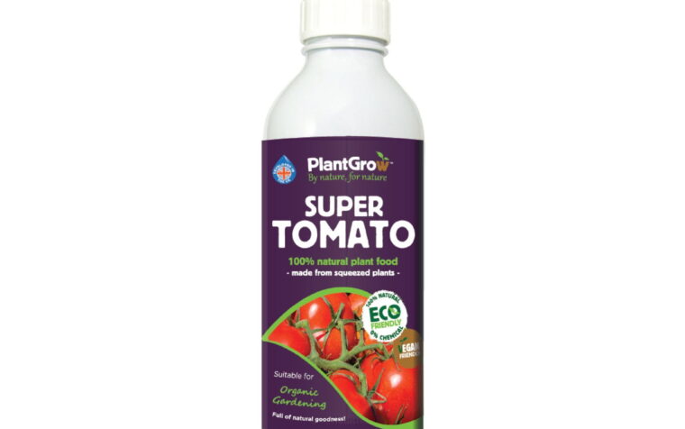 PlantGrow Super Tomato liquid plant food bottle with purple label, 100% natural plant-based formula in clear container.
