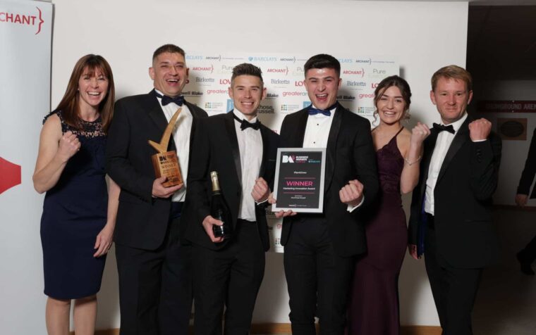 PlantGrow team celebrating with Marketing Innovation Award at Norfolk Business Awards ceremony.