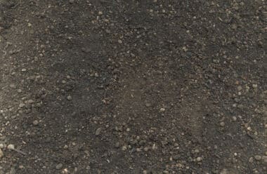 Close-up of PlantGrow Raised Bed Mix soil, showing screened topsoil, compost and organic fibre blend.