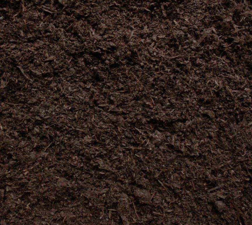 Dark, crumbly peat-free compost with visible organic matter and plant-based ingredients.