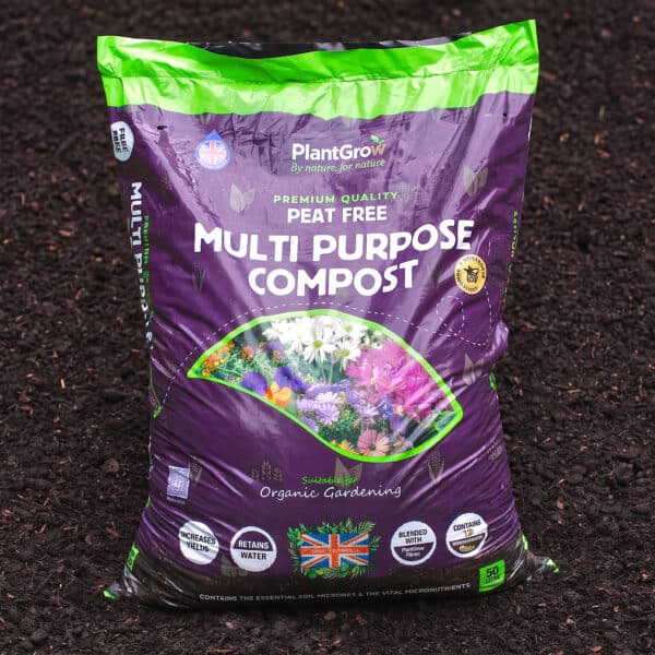 PlantGrow peat-free multi-purpose compost single bag with purple packaging on dark soil background.