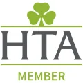 Logo featuring "HTA" in large gray letters with a green clover above and a green horizontal line above and below. Below "HTA," "MEMBER" is written in green.
